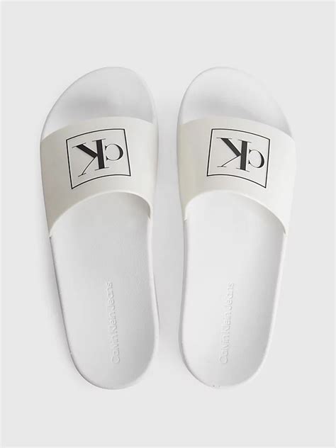 Calvin Klein Logo Sliders .